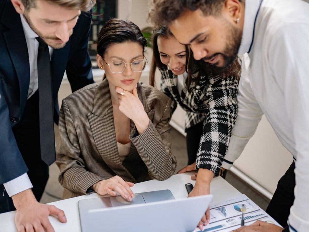Team reviewing data on a laptop.