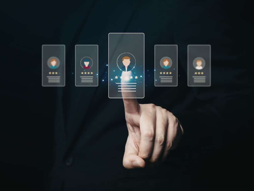 Hand selecting profile icon from digital candidates list.