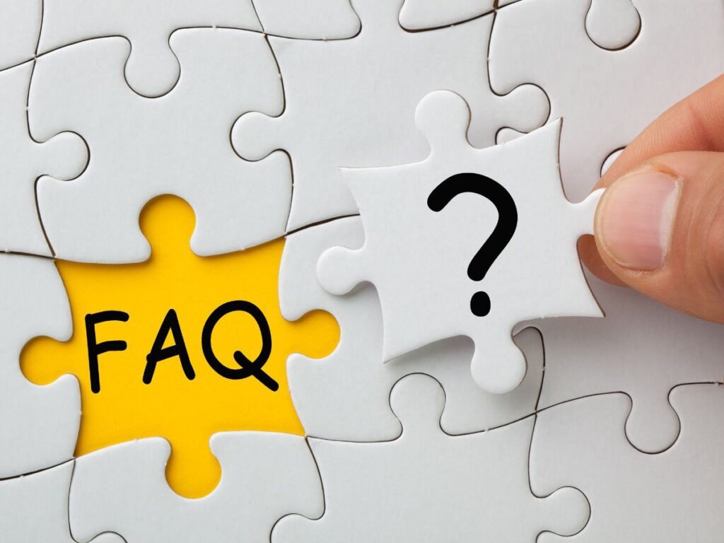 Puzzle pieces showing FAQ and a question mark.