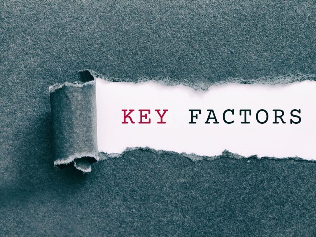 Torn paper revealing “Key Factors.”