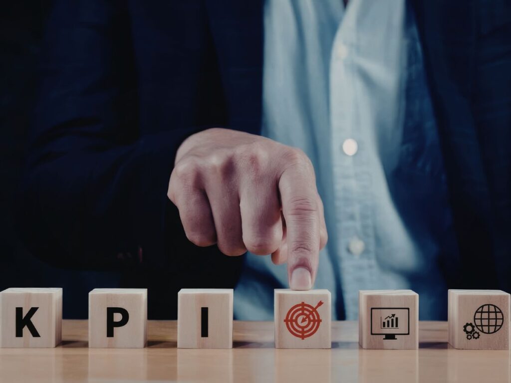 Finger selecting KPI and target icons