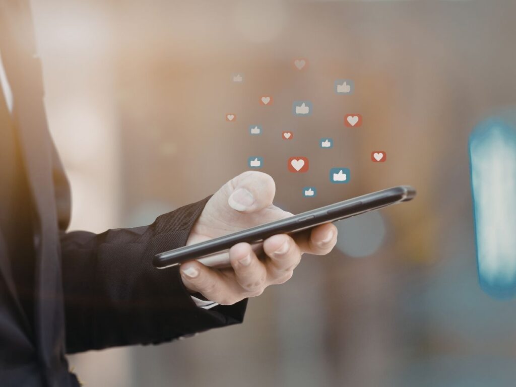 Phone with floating social media reactions