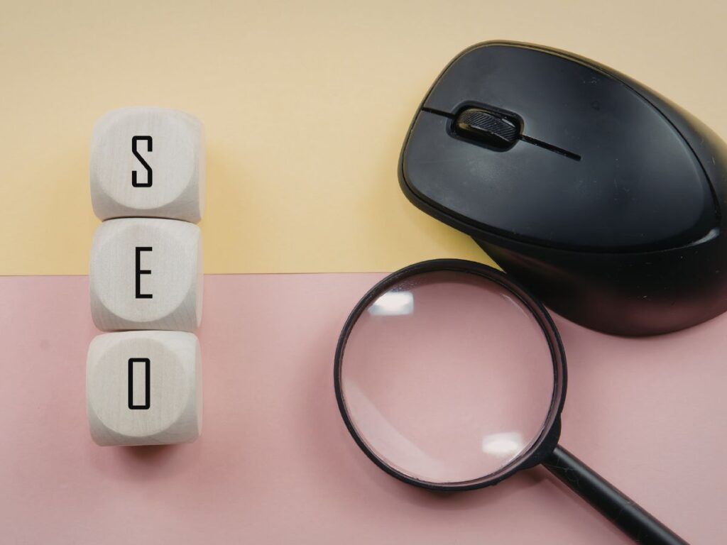 SEO blocks beside a mouse and magnifier