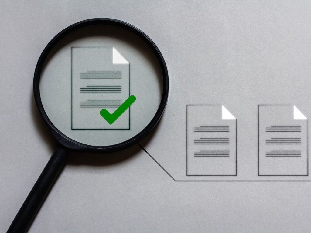 Magnifier checking a document.