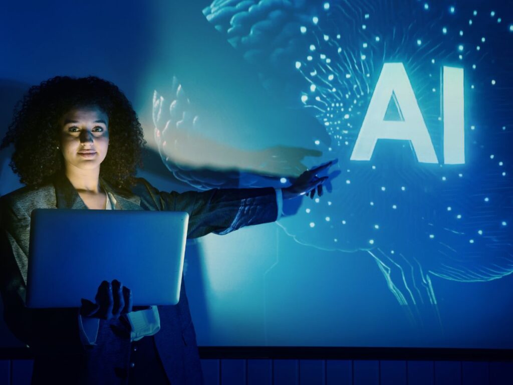 Woman holding laptop beside glowing AI graphic.