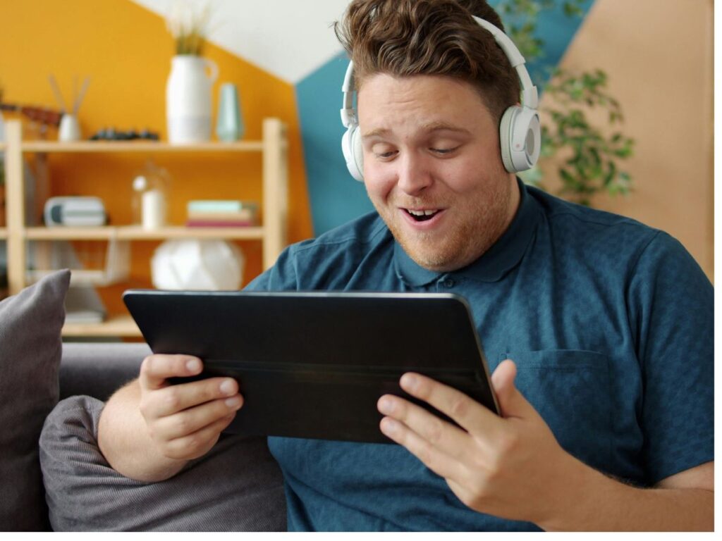 Man watching content on a tablet.