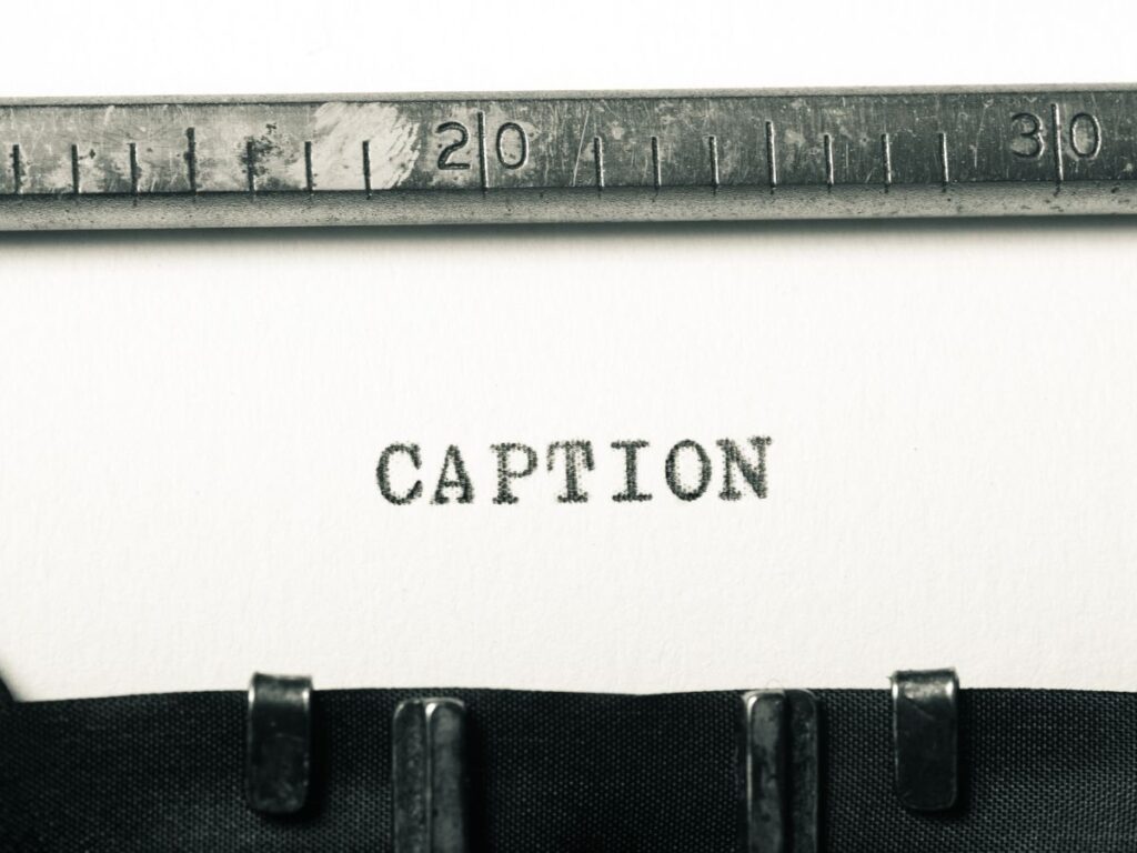 Typewriter page with the word “Caption”