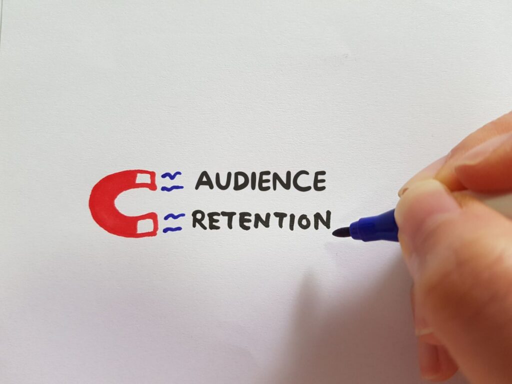 Audience retention text with a magnet drawing