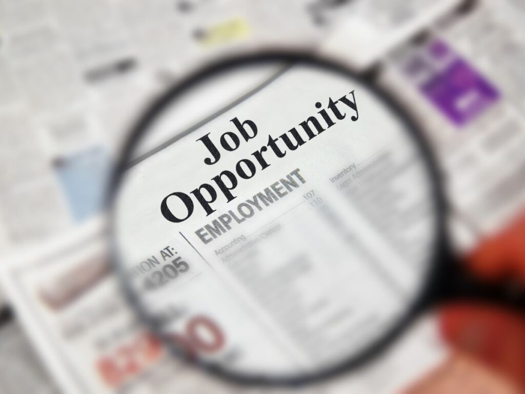 Magnified job opportunity listing for career growth concept